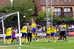 Harvey Washington gets above the Tividale defence to head at goal