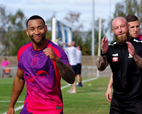 Yes boys! Darrhyl Mason is delighted while Deakz shows his appreciation to the travelling faithful